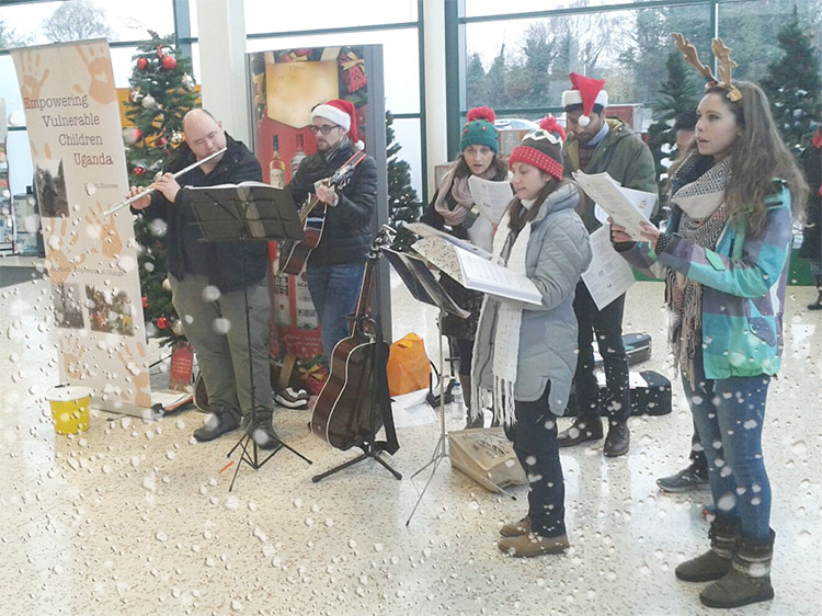 Carolling for EVC Uganda fundraising