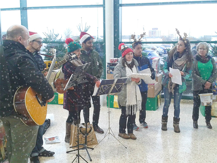 Carolling for EVC Uganda fundraising